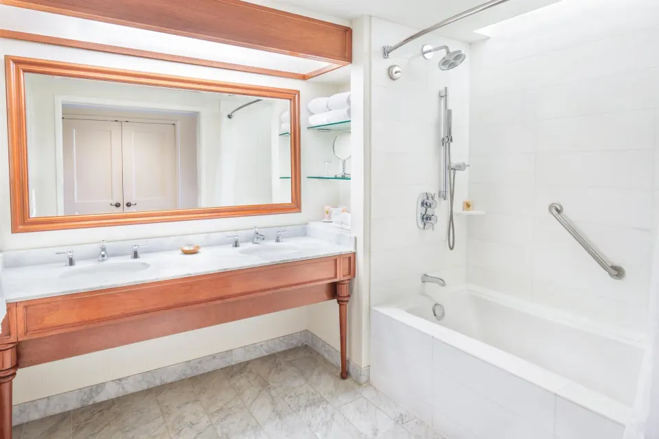 Resort View room bathroom with double vanity and tub at Grand Hyatt Kauai Resort and Spa and Spa.