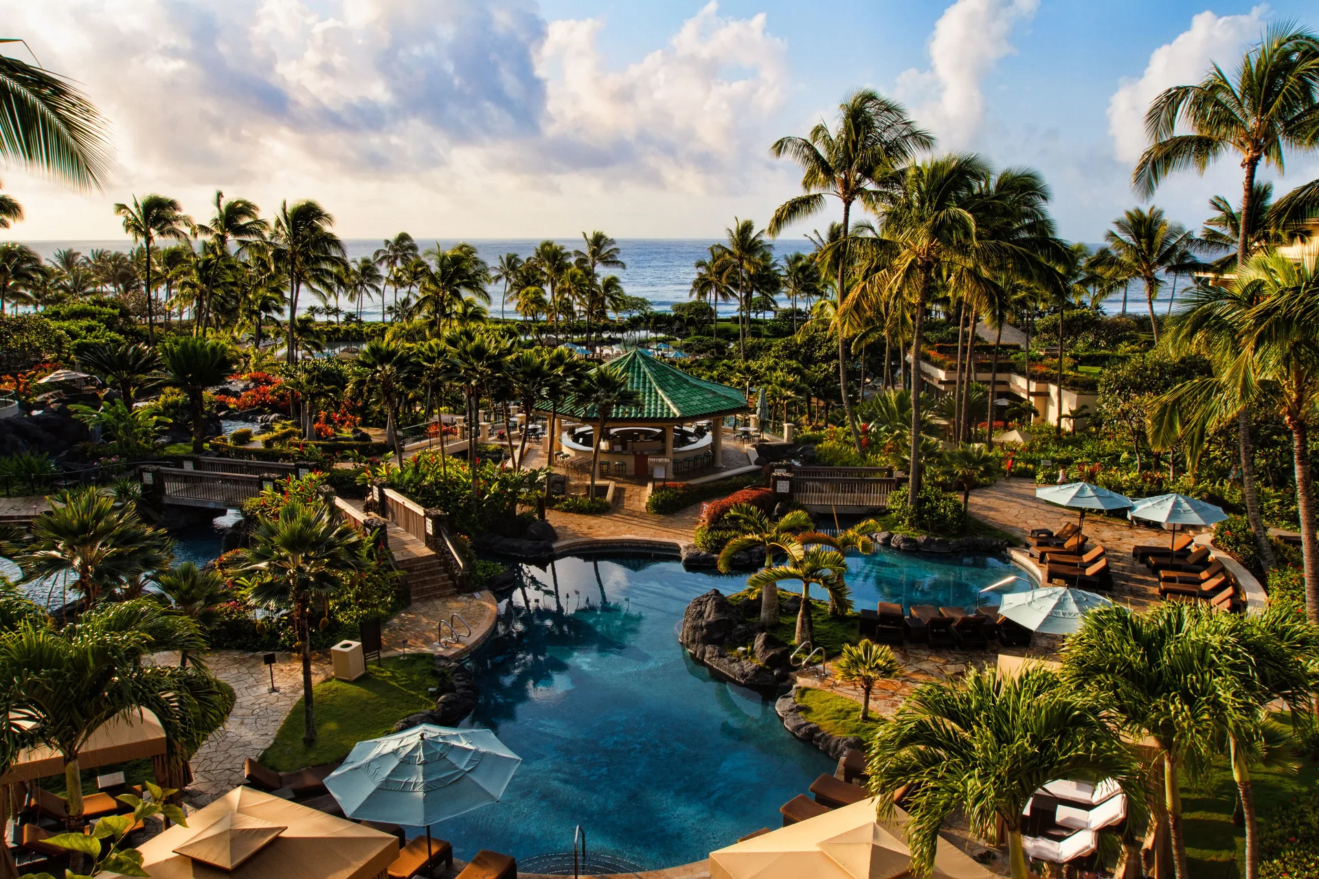Resort View room outlook over pools, palms, and ocean at Grand Hyatt Kauai Resort and Spa and Spa.