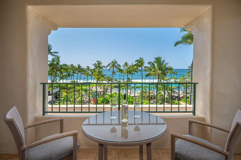 Royal Suite balcony with oceanfront palm and pool views at Grand Hyatt Kauai Resort and Spa and Spa.