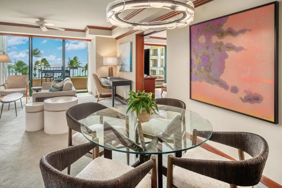 Ocean view suite dining table and living area at Grand Hyatt Kauai Resort and Spa and Spa.
