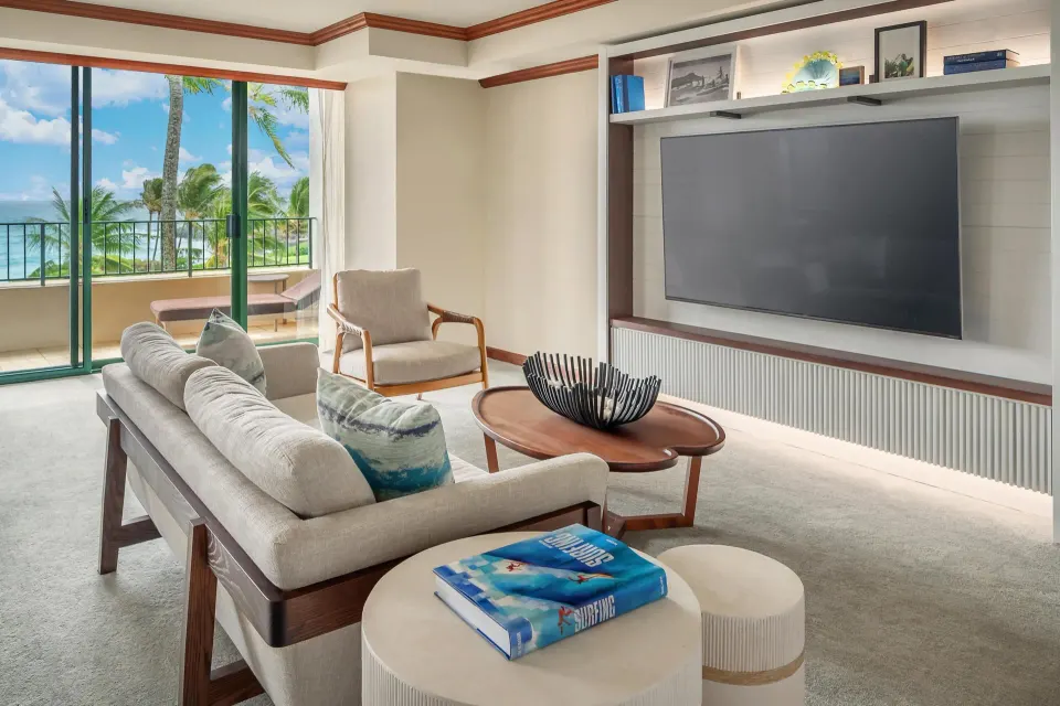 Ocean view suite living room with TV, sofa, and balcony at Grand Hyatt Kauai Resort and Spa and Spa.