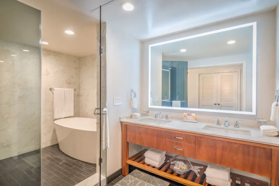 Pool Suite bathroom with double vanity and tub at Grand Hyatt Kauai Resort and Spa and Spa.