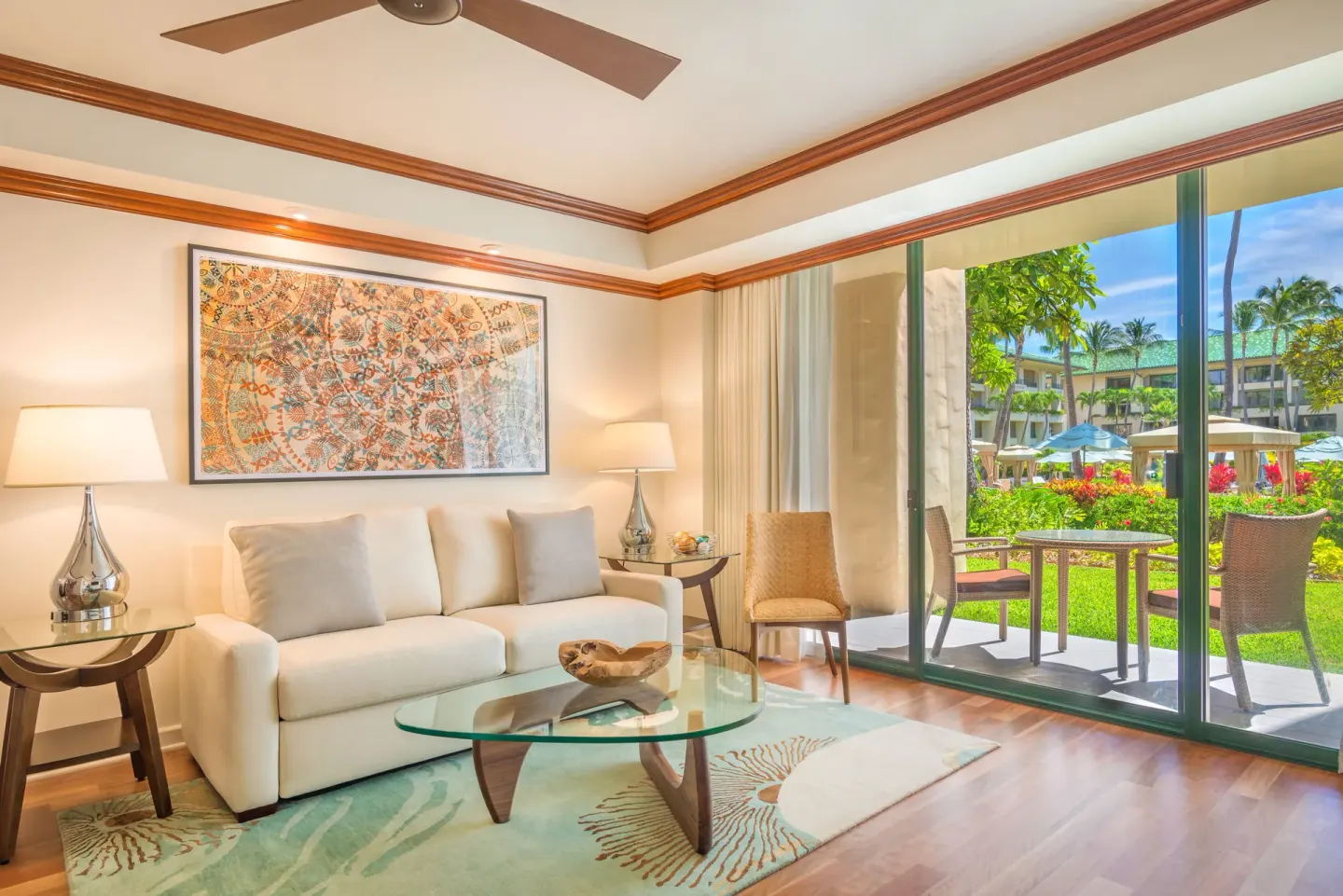 Pool Suite living room with sofa and patio at Grand Hyatt Kauai Resort and Spa and Spa.