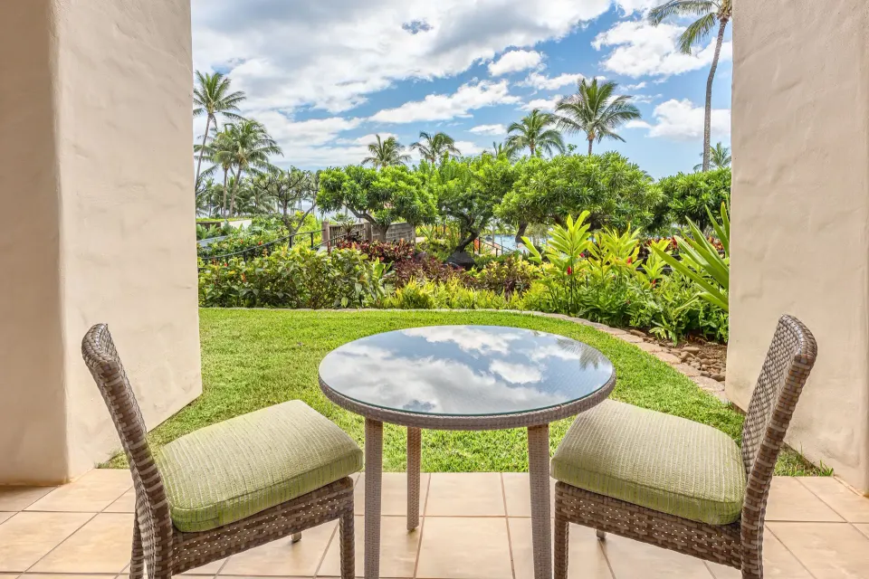 Pool Suite patio table with tropical garden view at Grand Hyatt Kauai Resort and Spa and Spa.