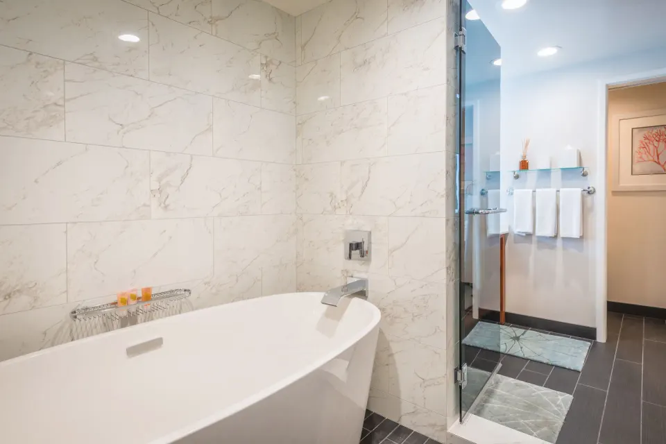 Pool Suite soaking tub and glass shower at Grand Hyatt Kauai Resort and Spa and Spa.