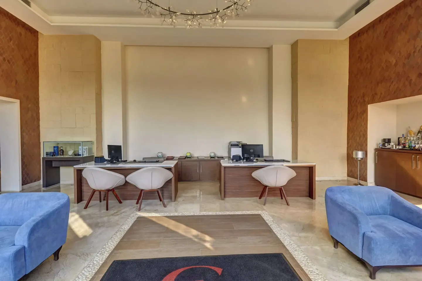 Lobby seating and reception desks inside Grand Lido Negril Au-Naturel.