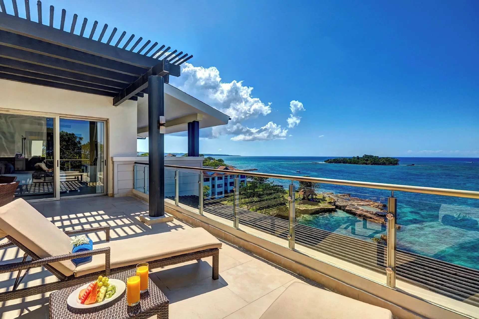 Ocean-view penthouse terrace with loungers at Grand Lido Negril Au-Naturel.