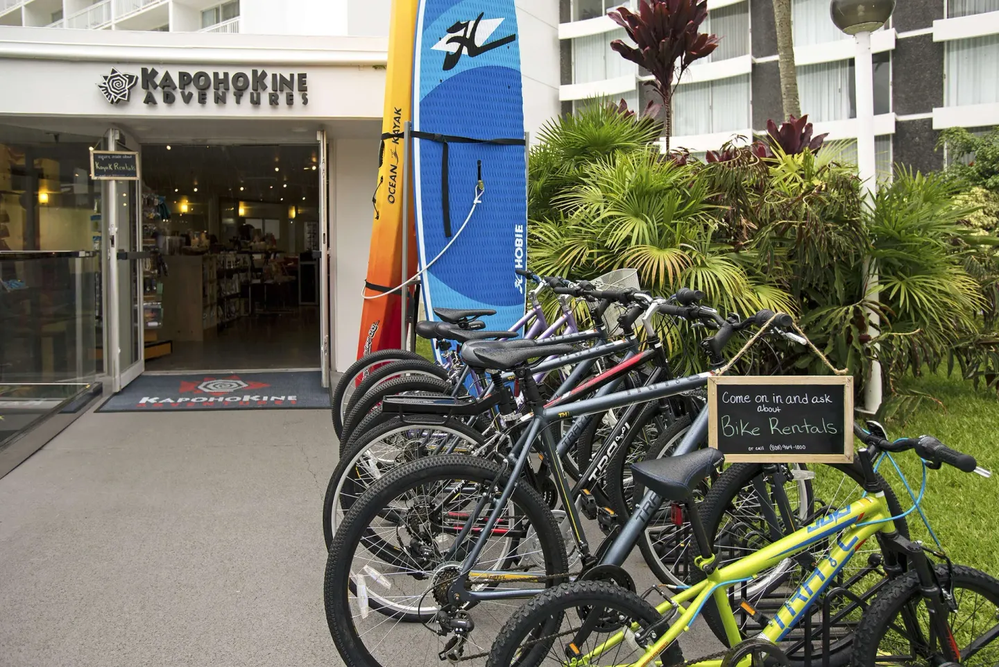 Bicycles and ocean boards outside an activity shop at Grand Naniloa Hotel Hilo.