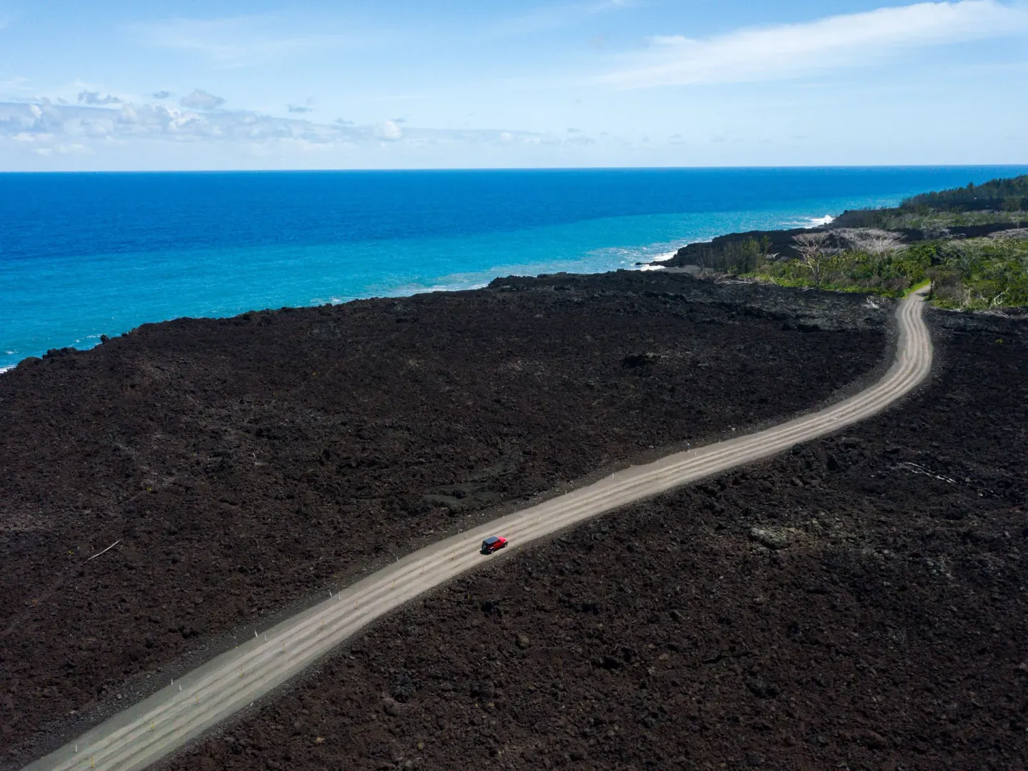 Coastal road crossing a lava field near Grand Naniloa Hotel Hilo.