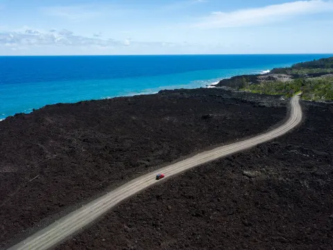 Coastal road crossing a lava field near Grand Naniloa Hotel Hilo.