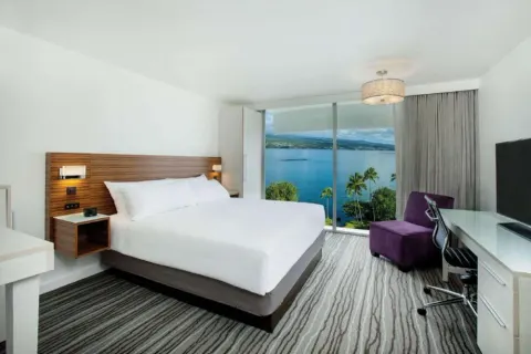 Ocean View Room with king bed and bay window at Grand Naniloa Hotel Hilo.