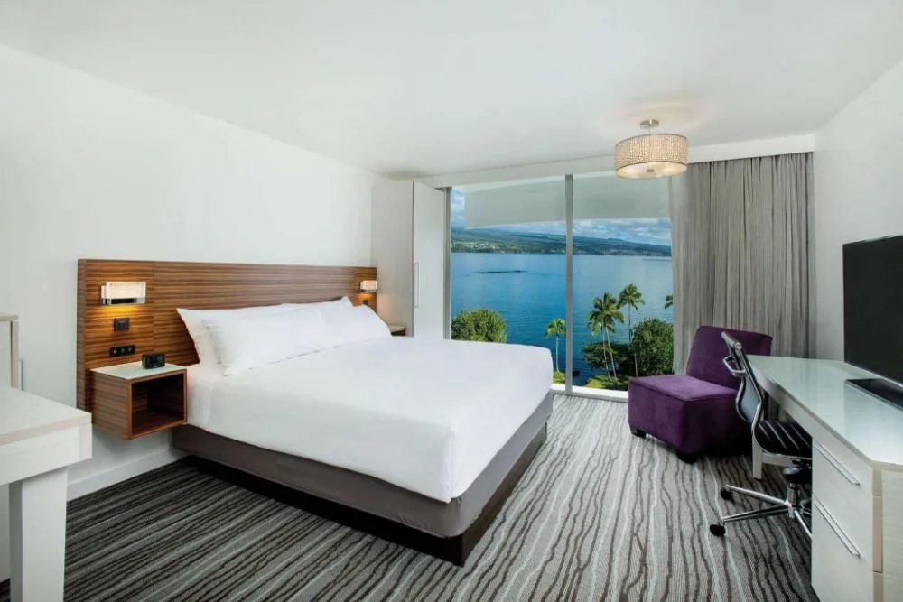 Ocean View Room with king bed and bay window at Grand Naniloa Hotel Hilo.