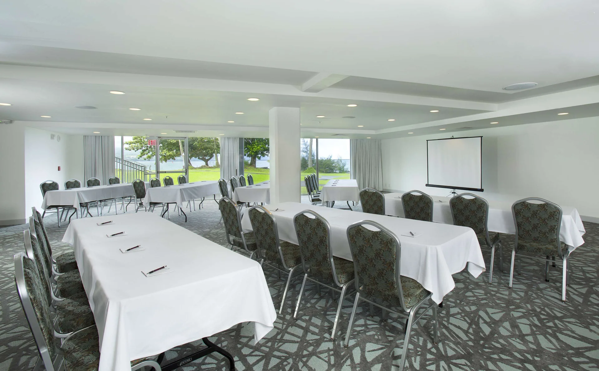 Event room with classroom seating and projection screen at Grand Naniloa Hotel Hilo.