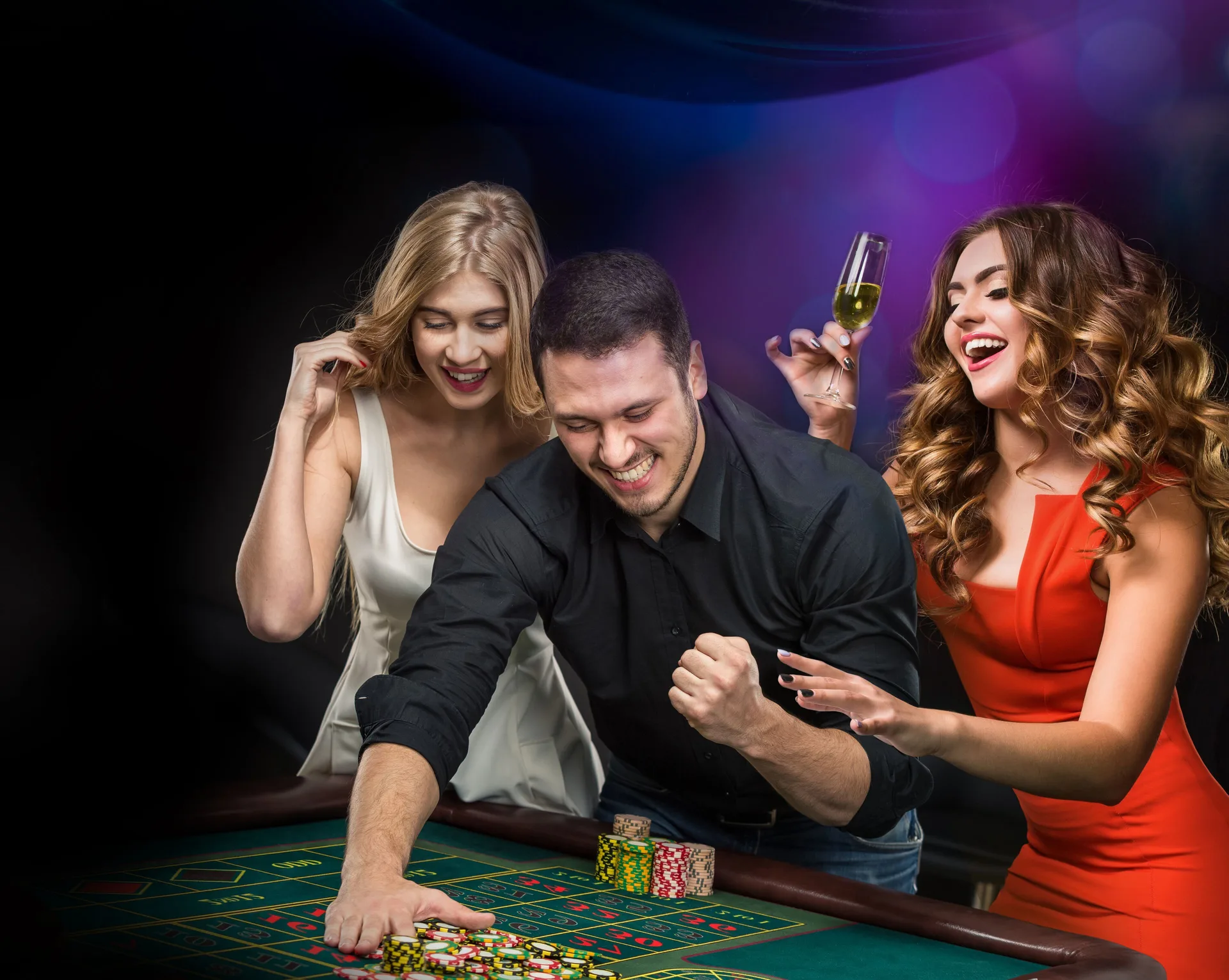 Guests celebrate at a casino-style gaming table at Grand Oasis Cancun.
