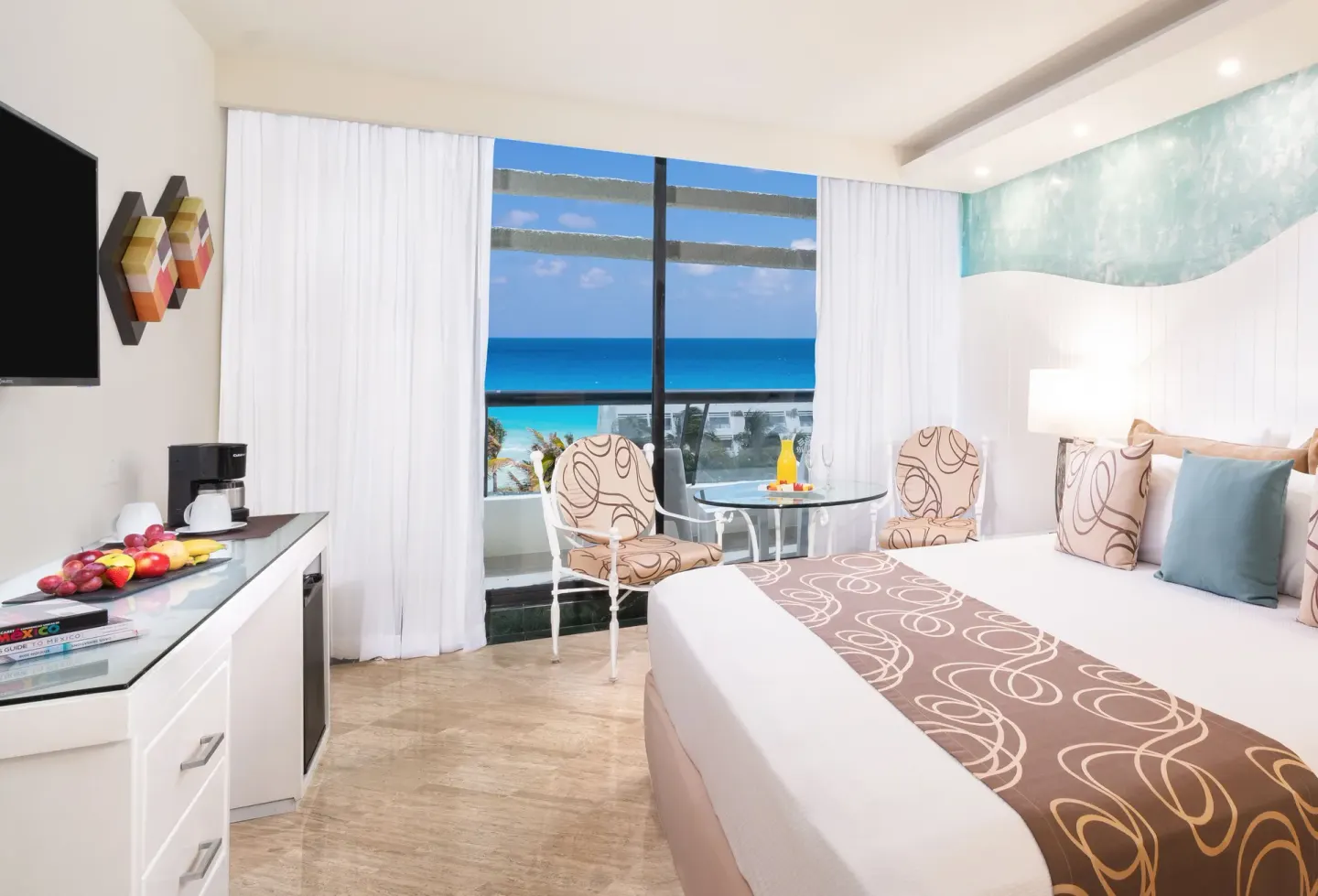 Grand Ocean View room with king bed and balcony ocean view at Grand Oasis Cancun.
