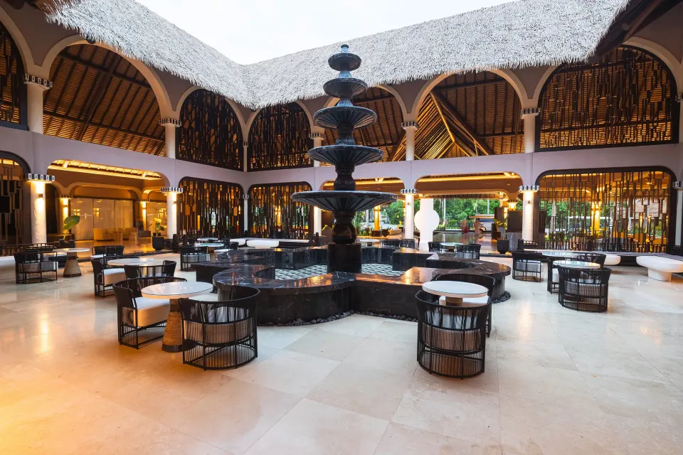 Indoor fountain and seating in resort atrium at Grand Palladium Colonial Resort & Spa