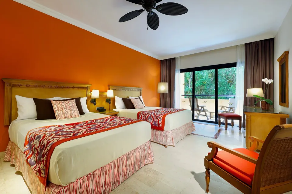 Deluxe single use room with two double beds and balcony at Grand Palladium Colonial Resort & Spa