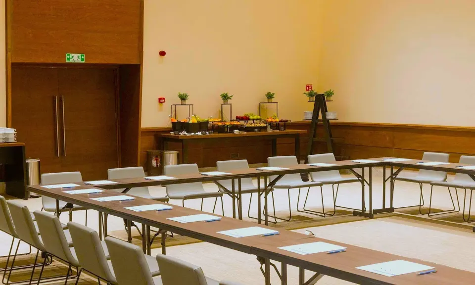 Conference room set up with U-shaped tables and buffet station at Grand Palladium Colonial Resort & Spa