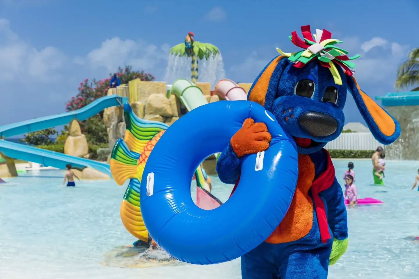 Costumed character holding a blue pool ring at Grand Palladium Jamaica Resort & Spa.