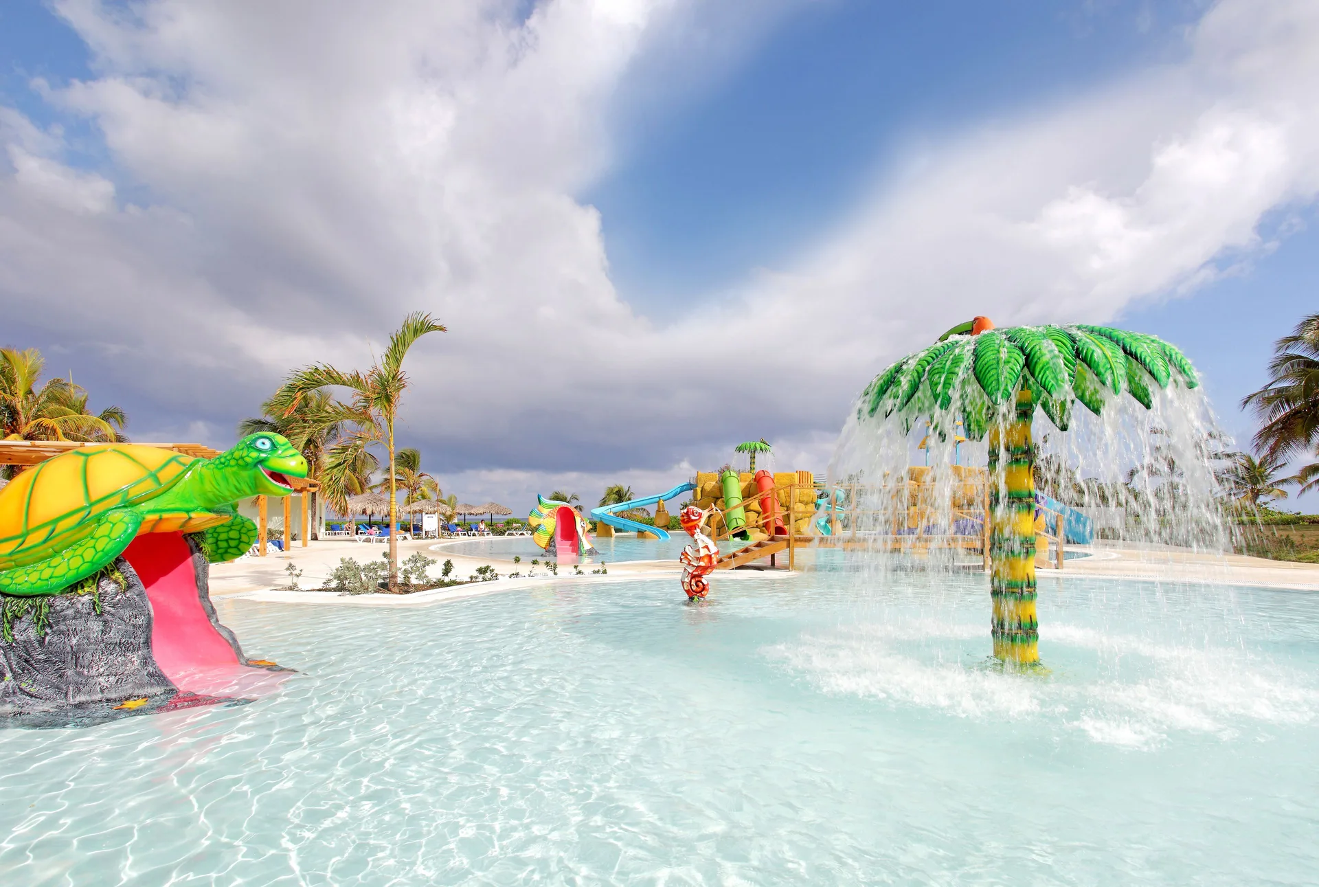 Children’s splash pool with turtle slide and palm sprayer at Grand Palladium Jamaica Resort & Spa.