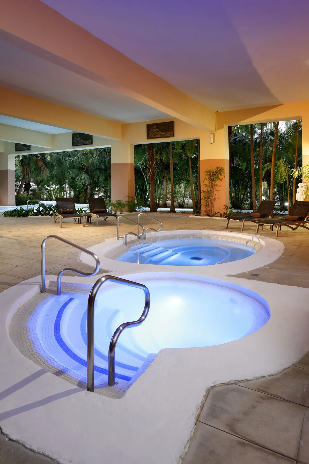 Indoor spa whirlpools with blue lighting at Grand Palladium Jamaica Resort & Spa.