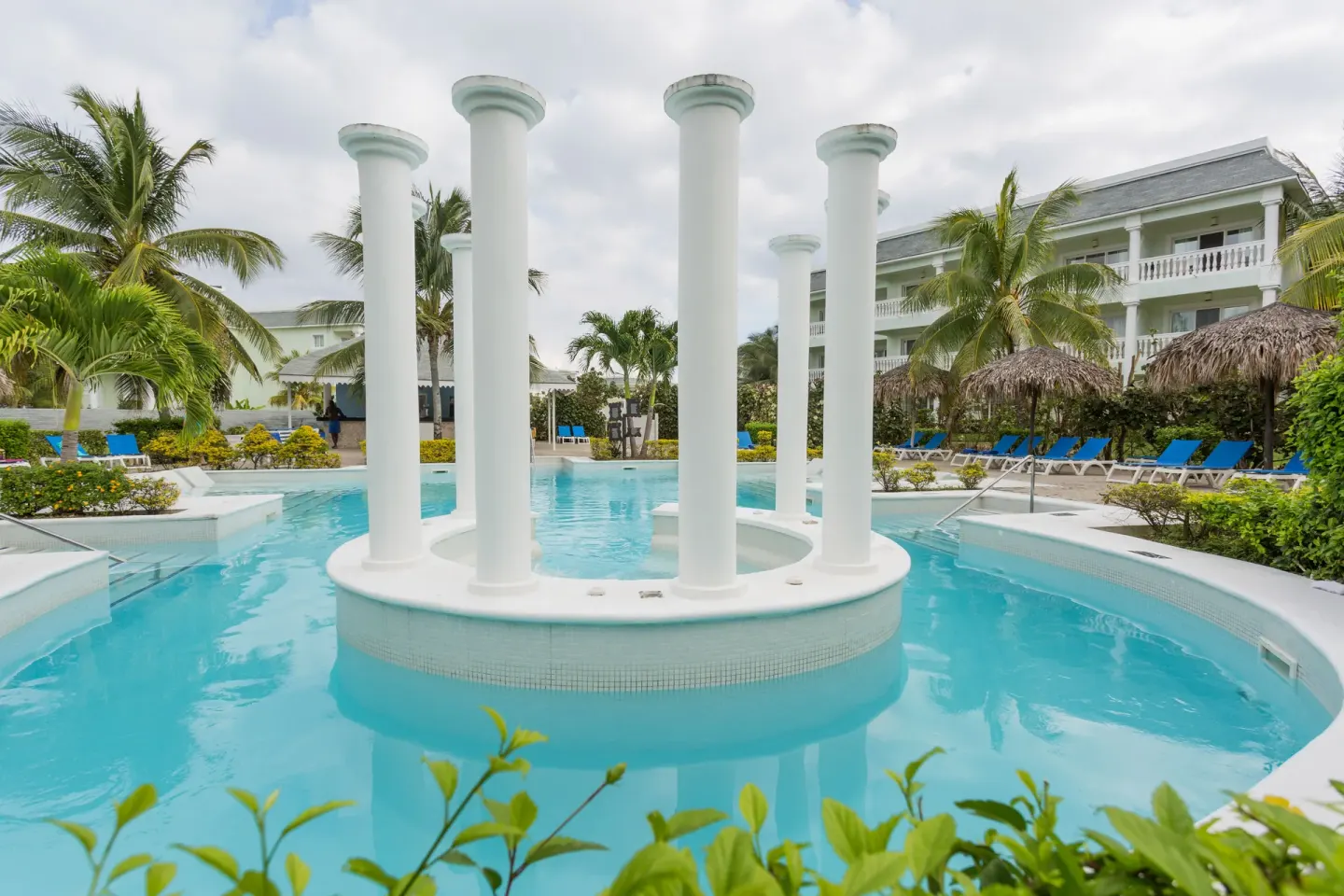 Pool island with tall white columns at Grand Palladium Jamaica Resort & Spa.