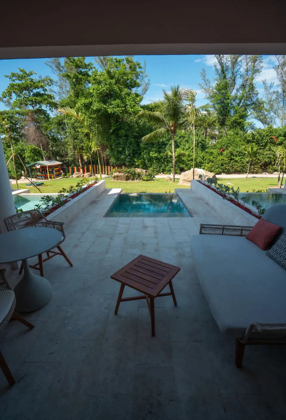 Shaded terrace with plunge pool and garden view at Grand Palladium Jamaica Resort & Spa.