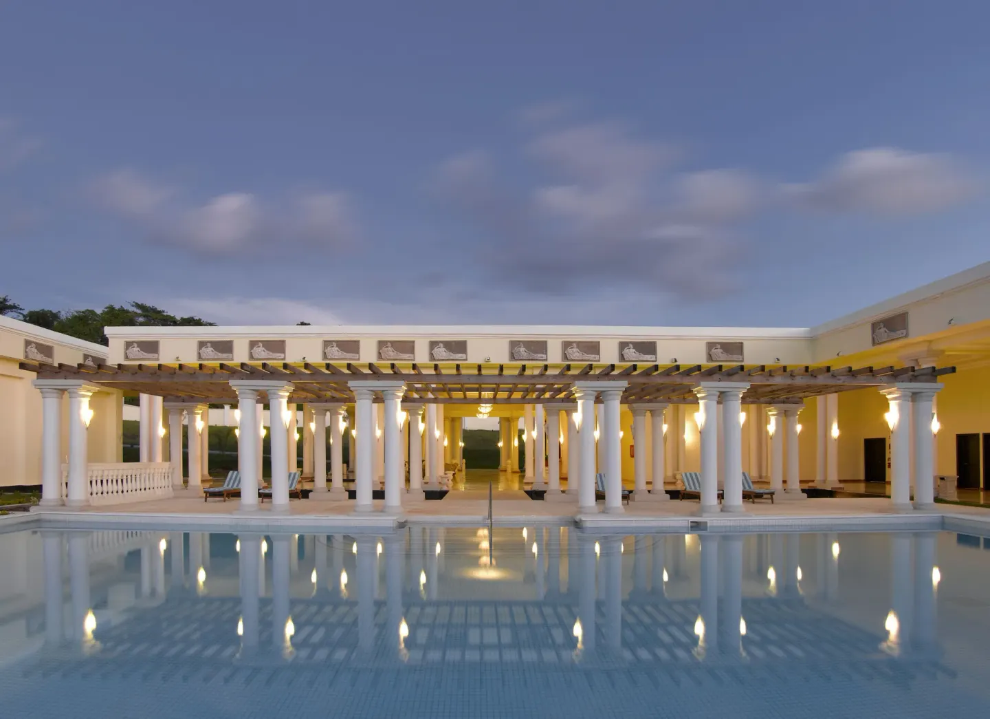 Twilight spa pool with lit columns at Grand Palladium Jamaica Resort & Spa.