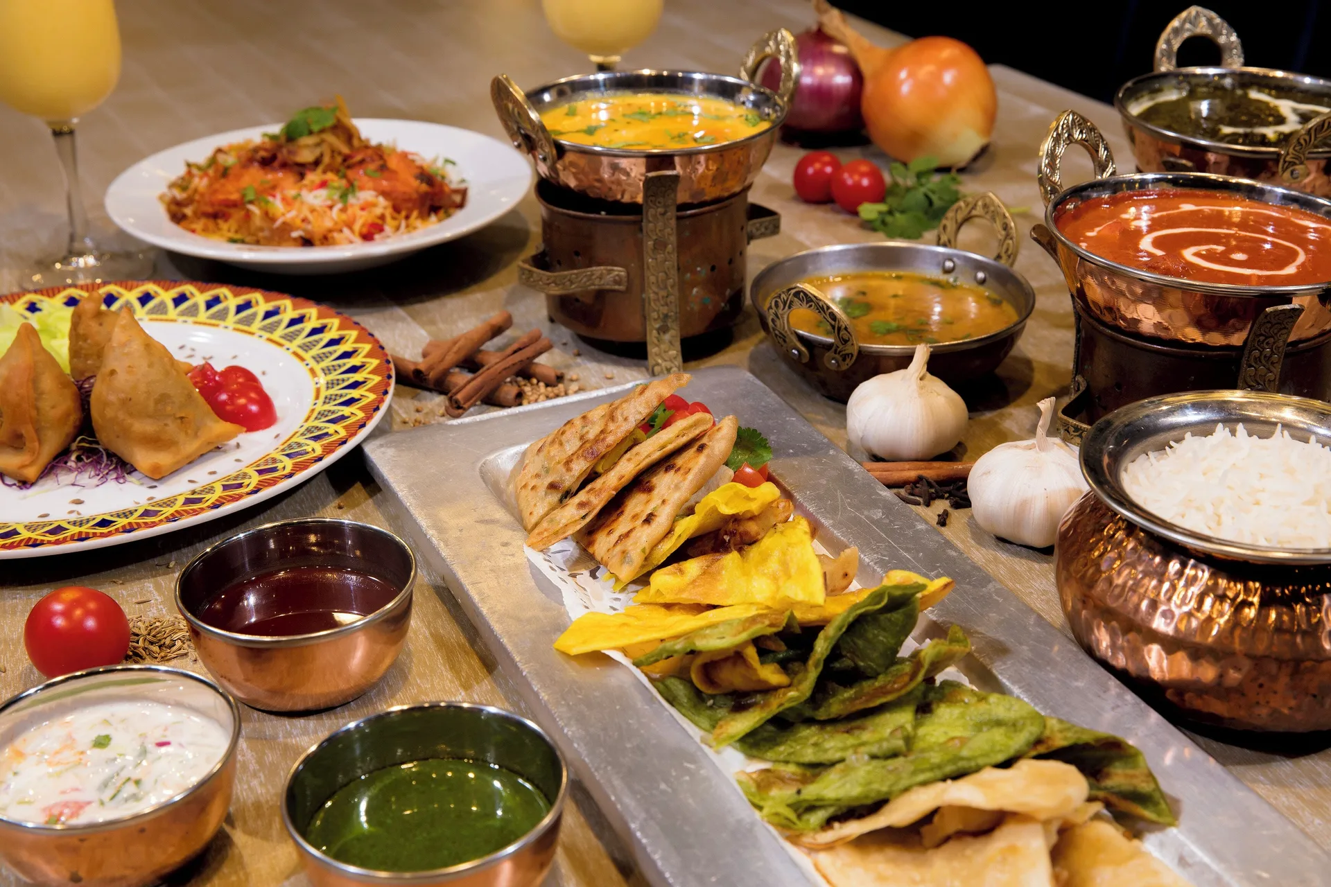 Indian dishes and sauces spread across a table at Grand Palladium Jamaica Resort & Spa.