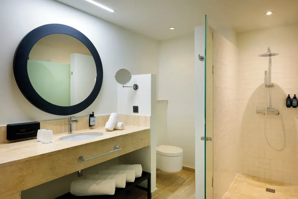 Junior Suite Oceanfront bathroom with vanity and shower at Grand Palladium Jamaica Resort & Spa.