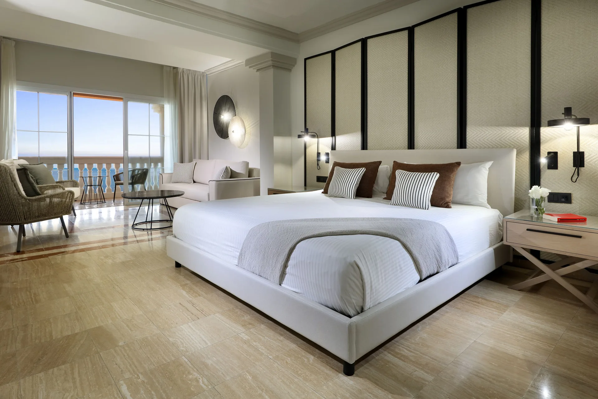 Junior Suite Oceanfront with king bed and balcony at Grand Palladium Jamaica Resort & Spa.