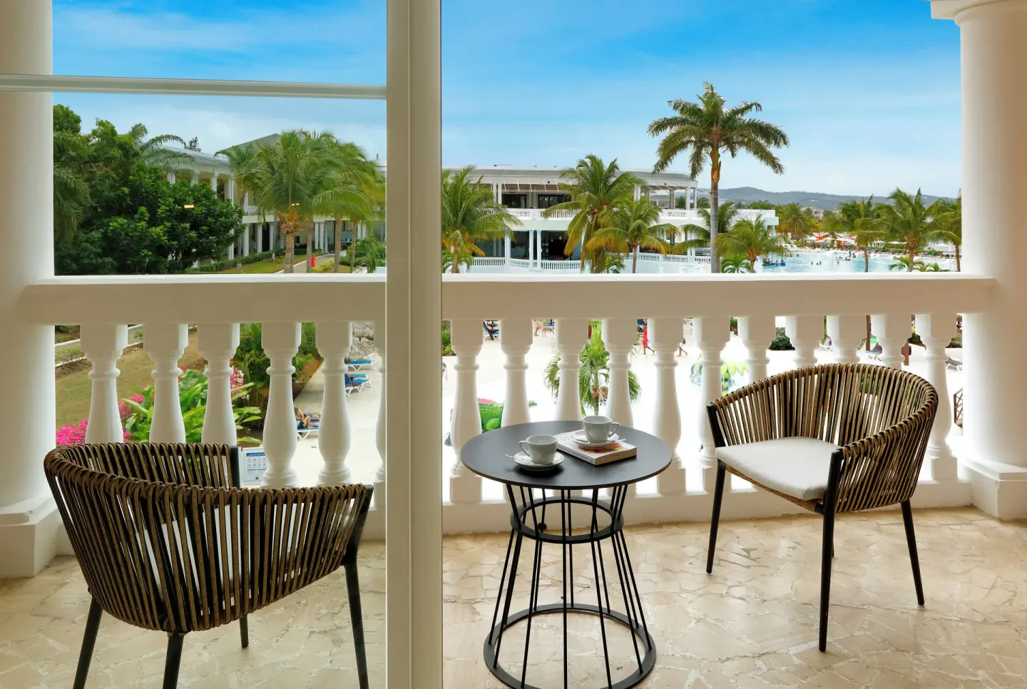 Junior Suite Poolside balcony seating at Grand Palladium Jamaica Resort & Spa.