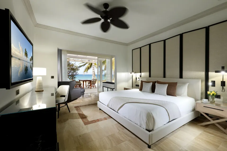 Junior Suite Poolside king bed with terrace view at Grand Palladium Jamaica Resort & Spa.