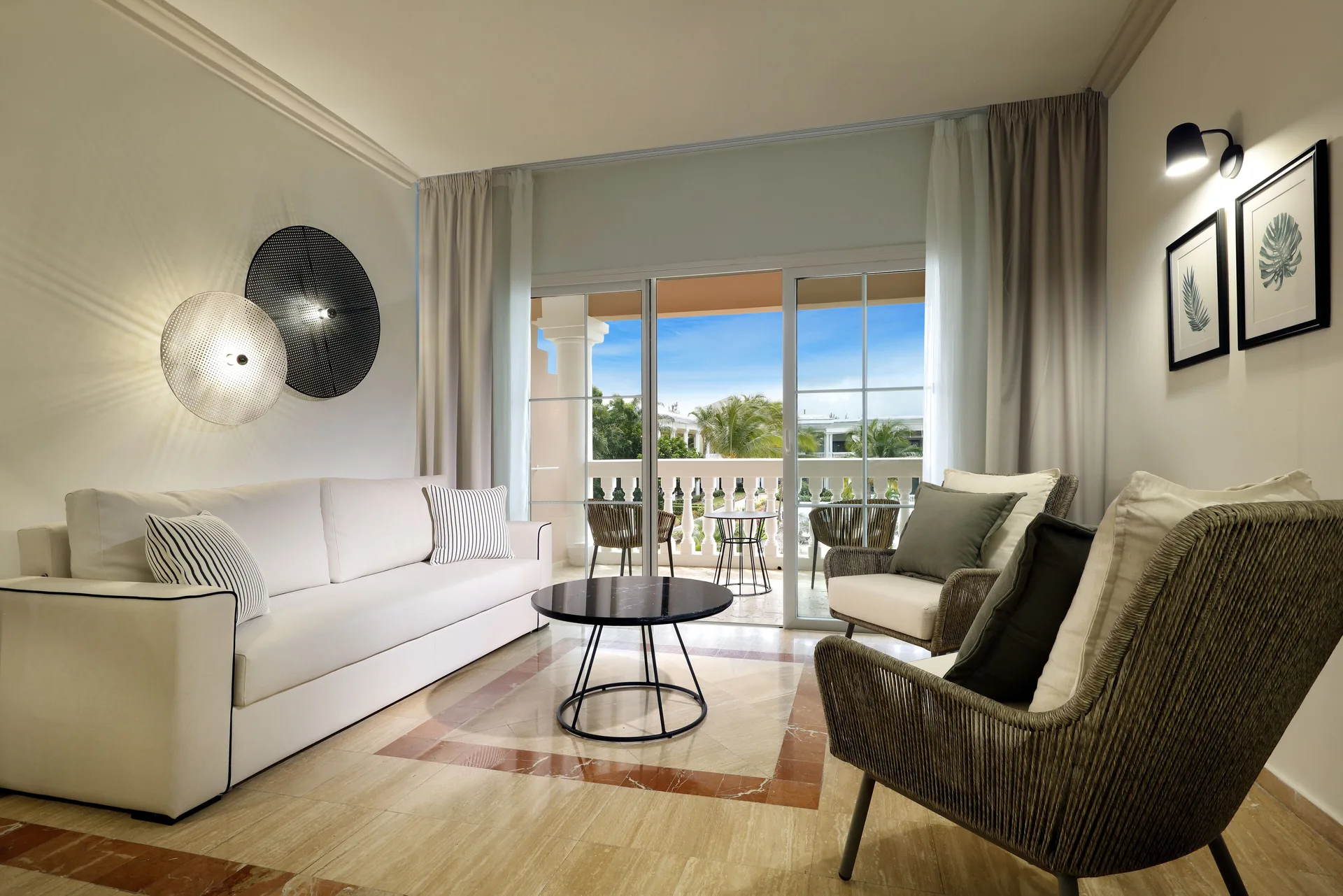 Junior Suite Poolside sitting area with balcony at Grand Palladium Jamaica Resort & Spa.