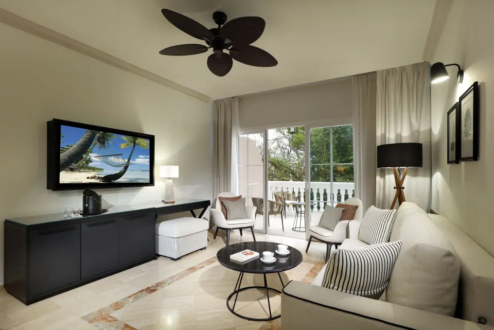 Oceanfront suite sitting area with balcony at Grand Palladium Jamaica Resort & Spa.