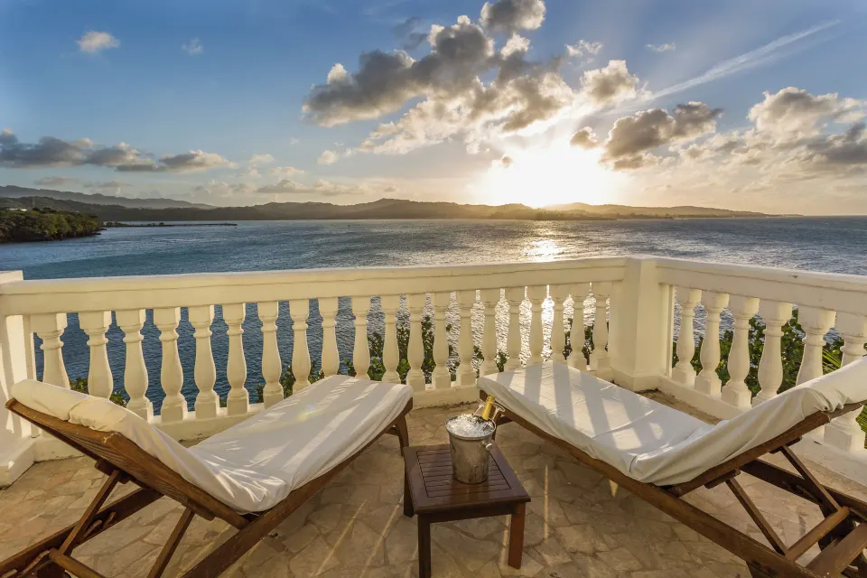 Oceanfront suite terrace with loungers and sea view at Grand Palladium Jamaica Resort & Spa.
