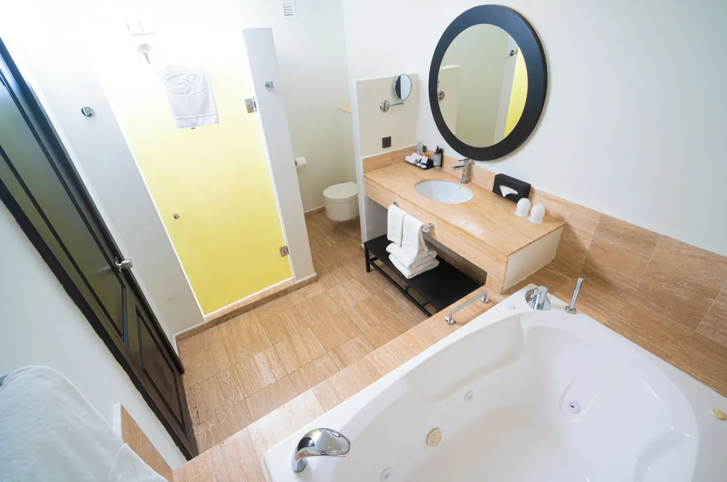 Suite bathroom with tub, vanity, and shower at Grand Palladium Jamaica Resort & Spa.