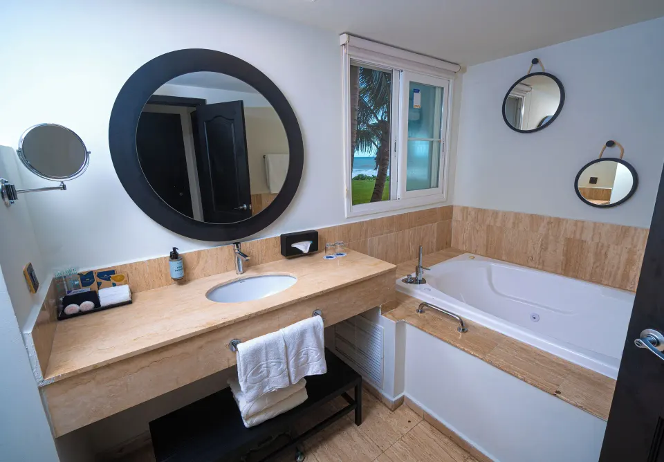 Bathroom vanity and jetted tub in the suite at Grand Palladium Jamaica Resort & Spa.