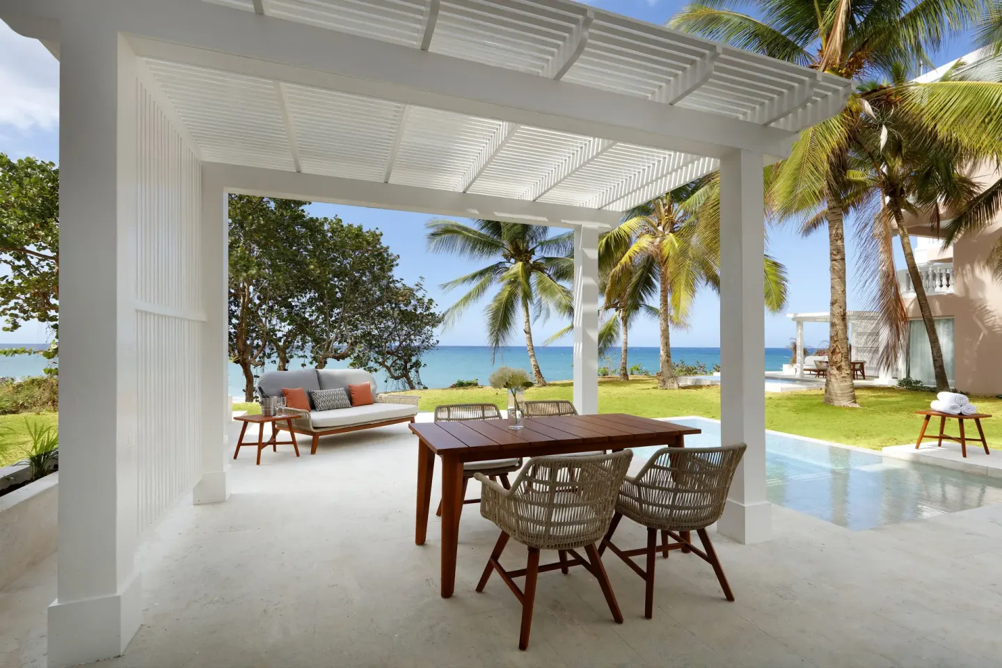 Covered oceanfront patio with pool at Grand Palladium Jamaica Resort & Spa.