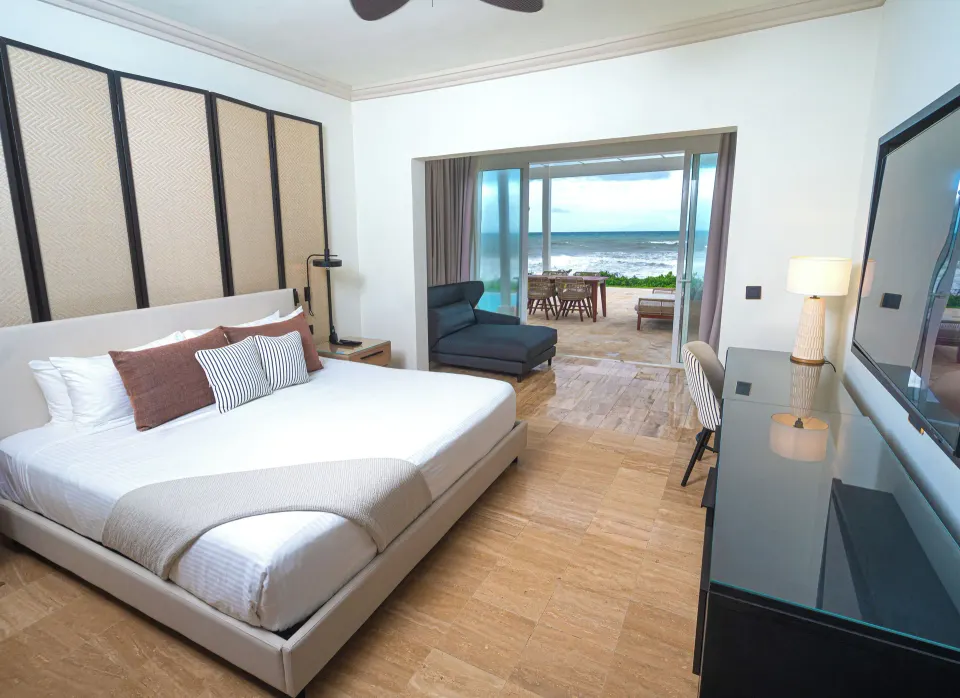 Oceanfront suite bedroom with patio view at Grand Palladium Jamaica Resort & Spa.