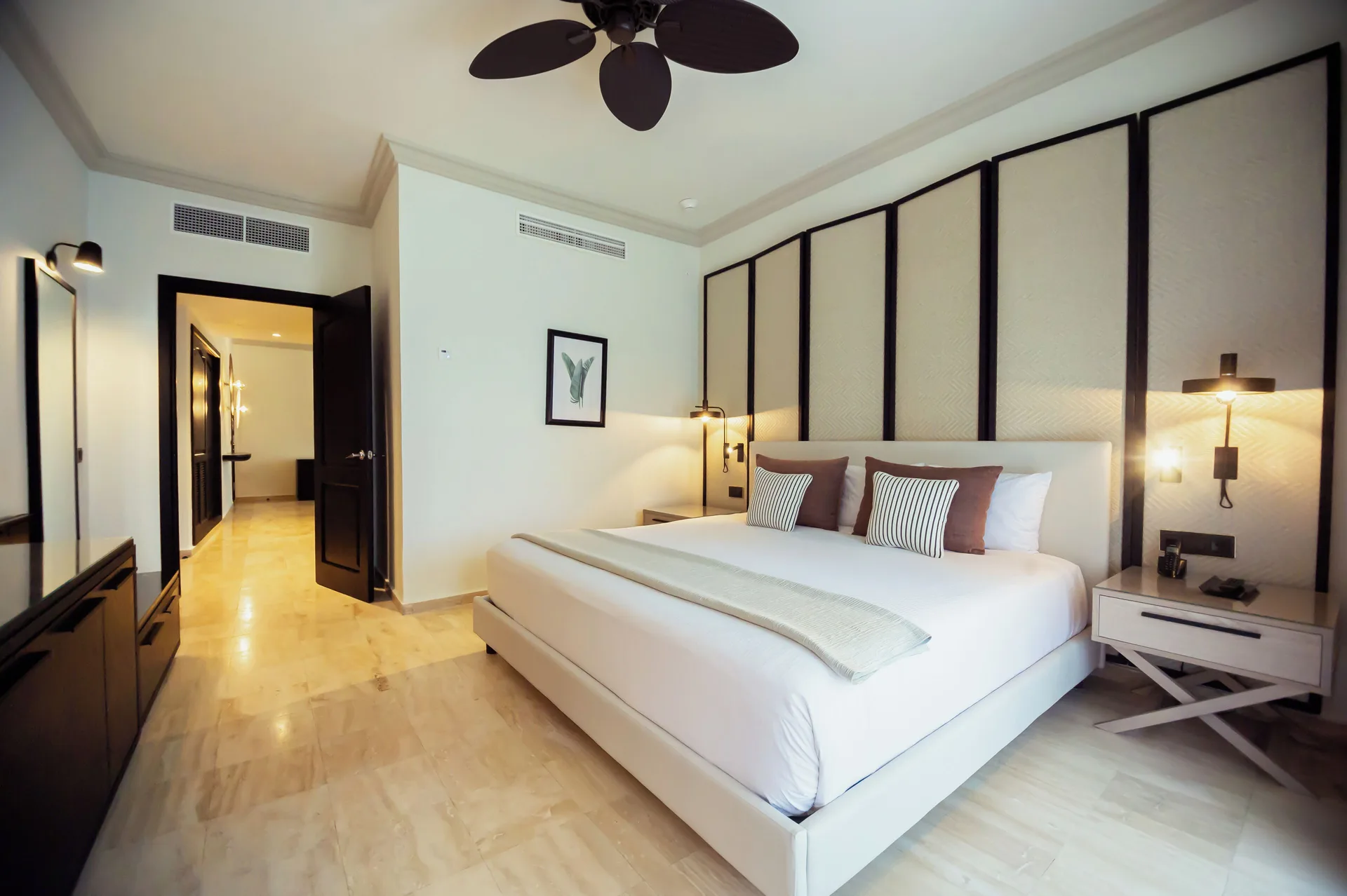 Suite at Grand Palladium Jamaica Resort & Spa with king bed, spacious bedroom layout, and modern furnishings.