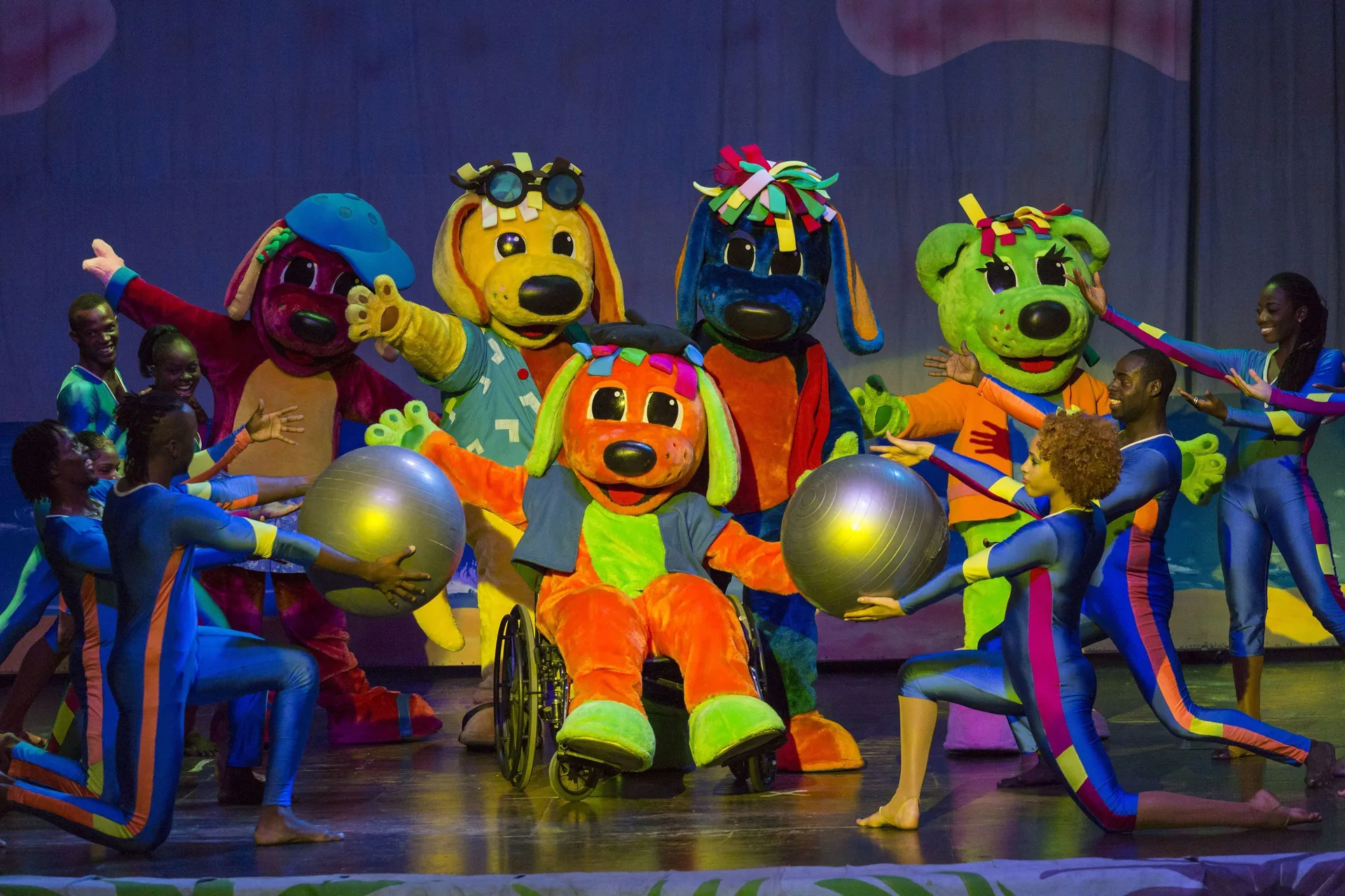 Colorful family stage show with dancers and mascots at Grand Palladium Jamaica Resort & Spa.