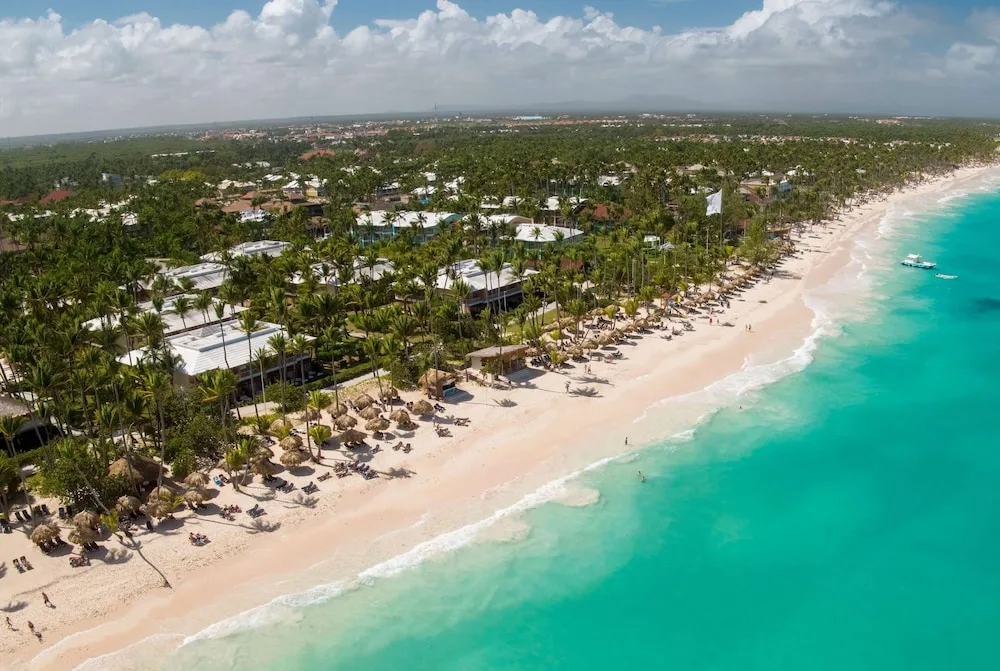 Aerial view of beach and resort grounds at Grand Palladium Palace Resort Spa & Casino.