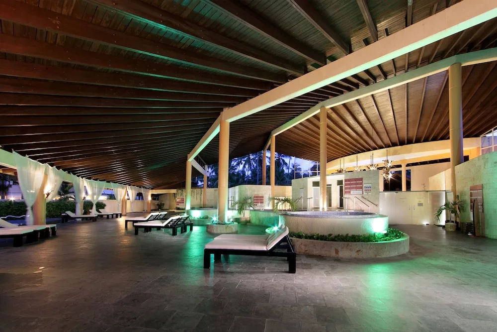 Covered spa relaxation area with loungers at Grand Palladium Palace Resort Spa & Casino.