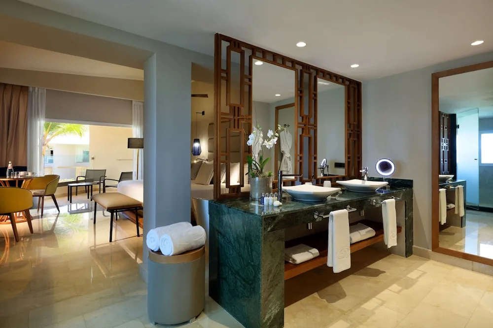 Suite vanity and living area at Grand Palladium Palace Resort Spa & Casino.
