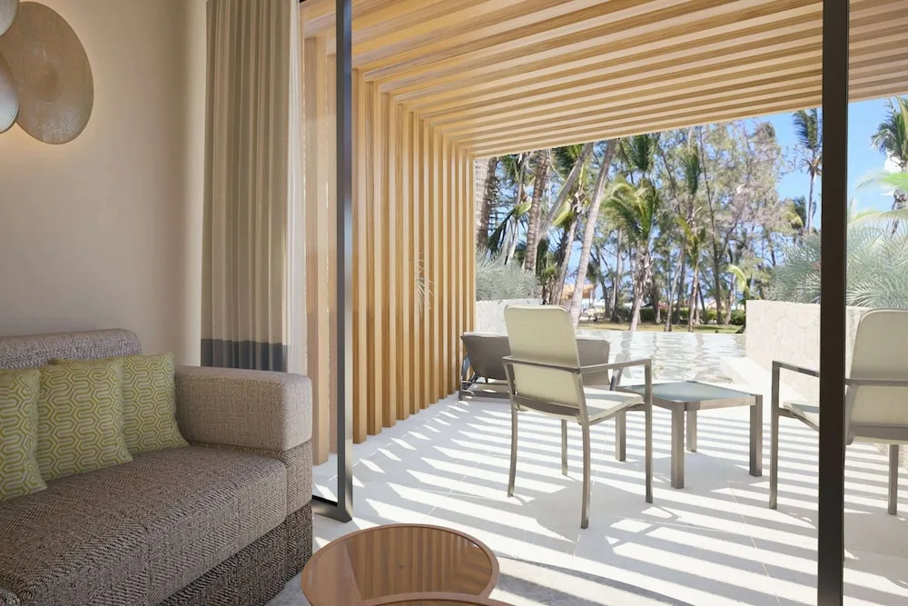 Terrace lounge and shaded patio at Grand Palladium Palace Resort Spa & Casino.