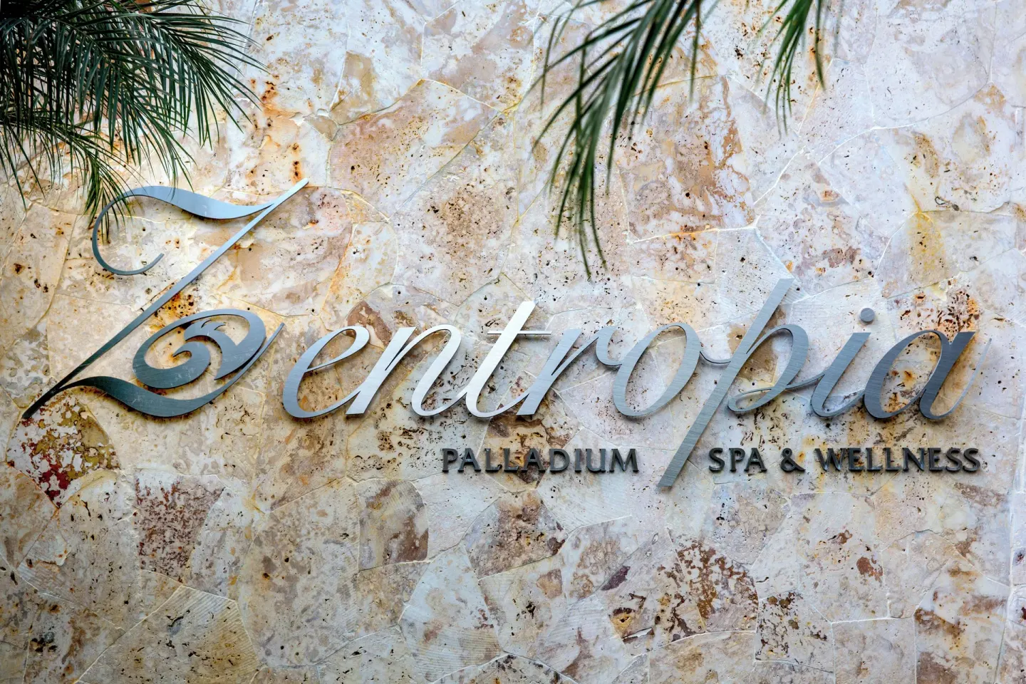 Zentropia spa sign on a stone wall at Grand Palladium Palace Resort Spa & Casino.