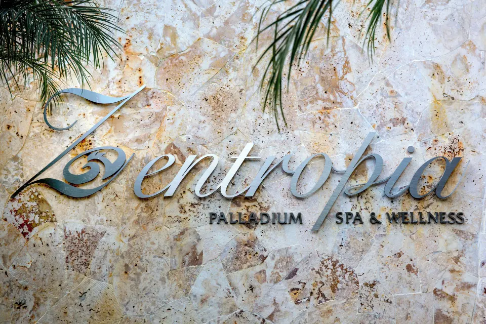 Zentropia spa sign on a stone wall at Grand Palladium Palace Resort Spa & Casino.
