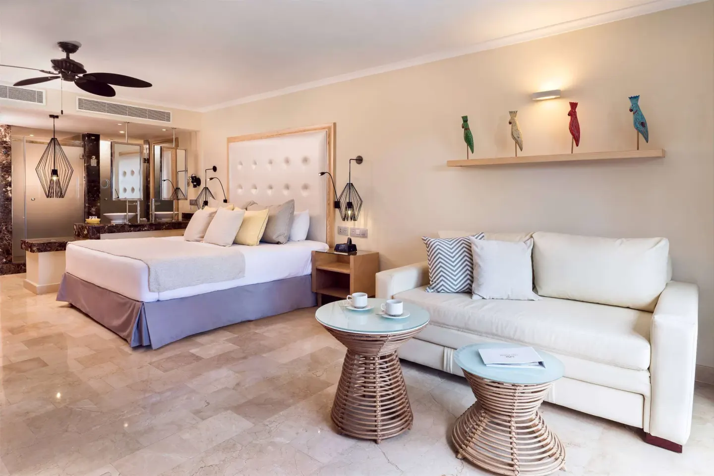 Junior Suite Beachside with king bed and sofa at Grand Palladium Palace Resort Spa & Casino.