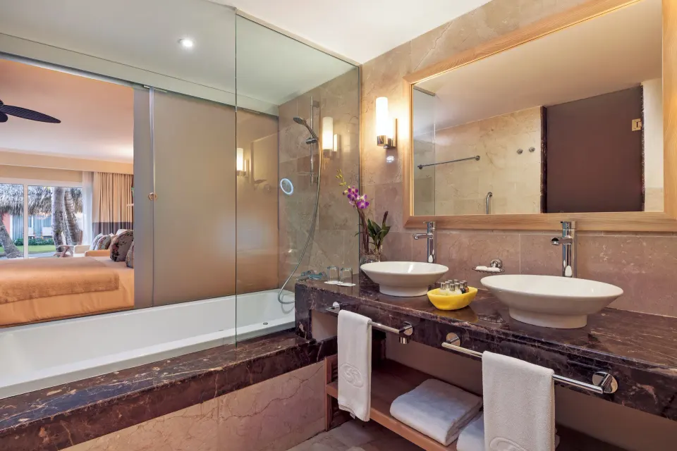Junior Suite Garden View bathroom vanity and tub at Grand Palladium Palace Resort Spa & Casino.